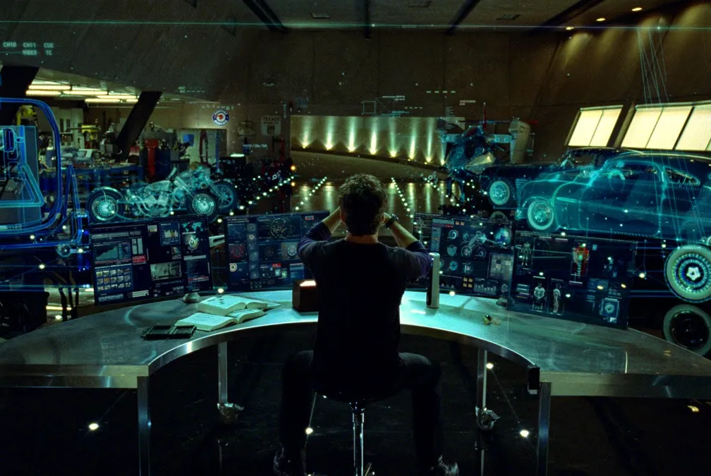 The workshop scene from Iron Man, with Tony Stark working alongside his AI assistant Jarvis.